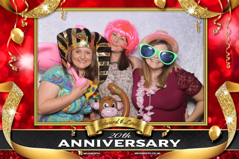 20th wedding anniversary photo booth template encapsulates 3 friends posing for selfie. They are wearing fancy dress props.
