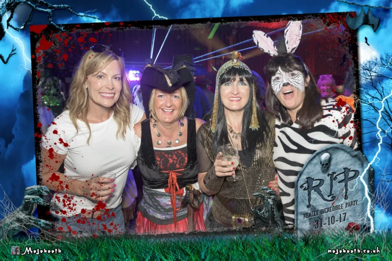 Halloween photo booth graveyard template encapsulates party goers at charity fancy dress event.