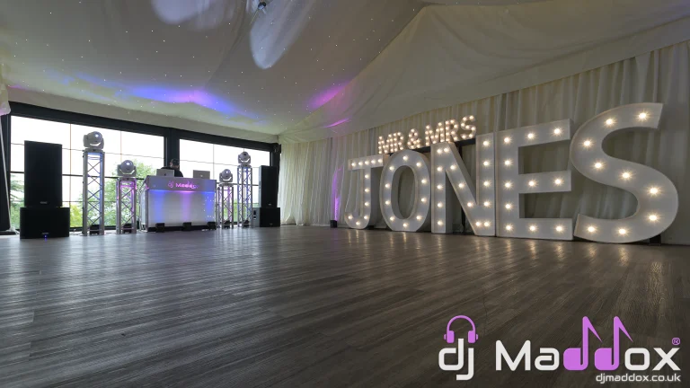 DJ Maddox setup with illuminated MR and MRS letters in the Garden Marquee at New House Country Hotel